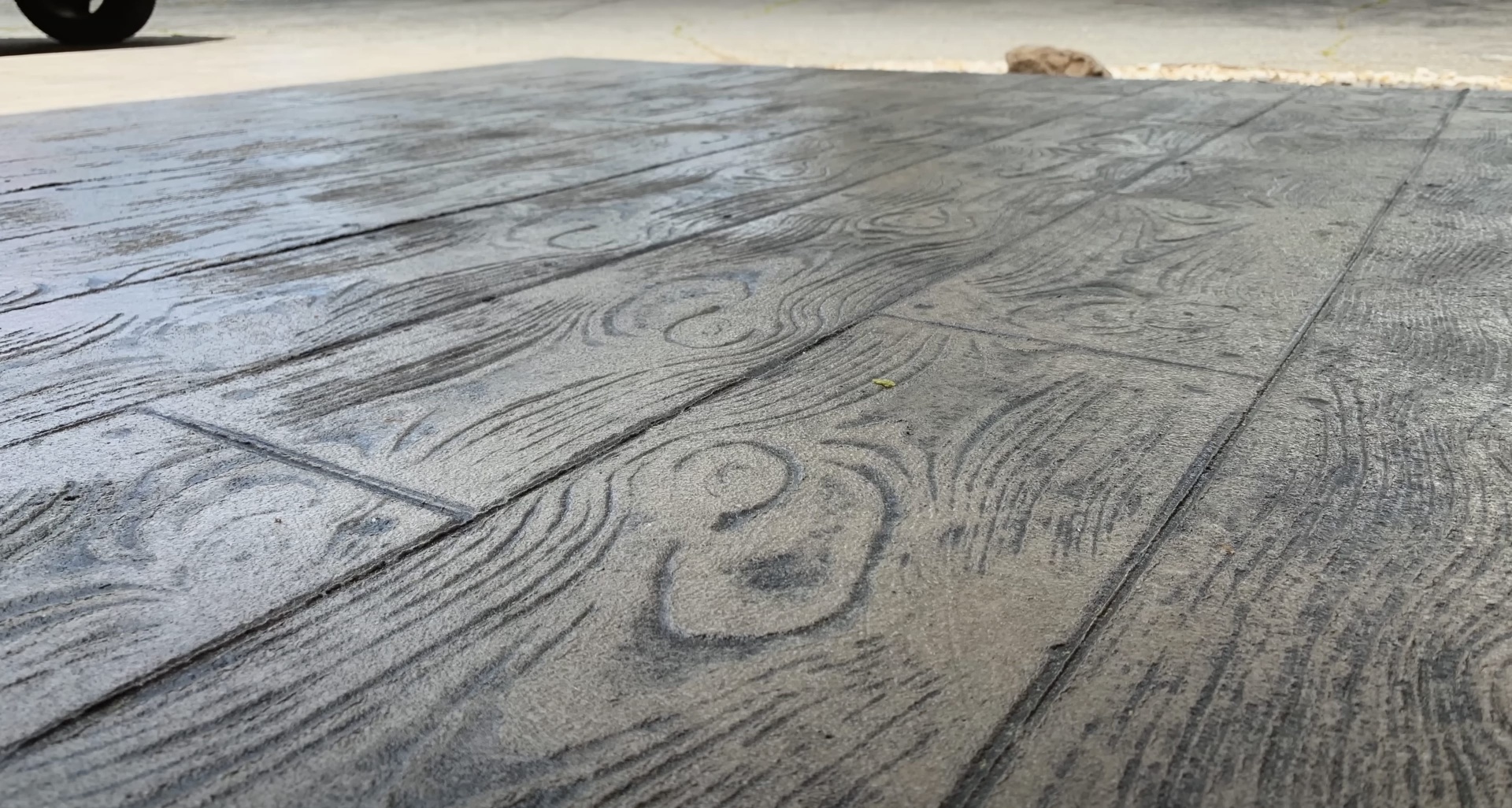 Detailed wood-grain stamped concrete pattern showing quality craftsmanship