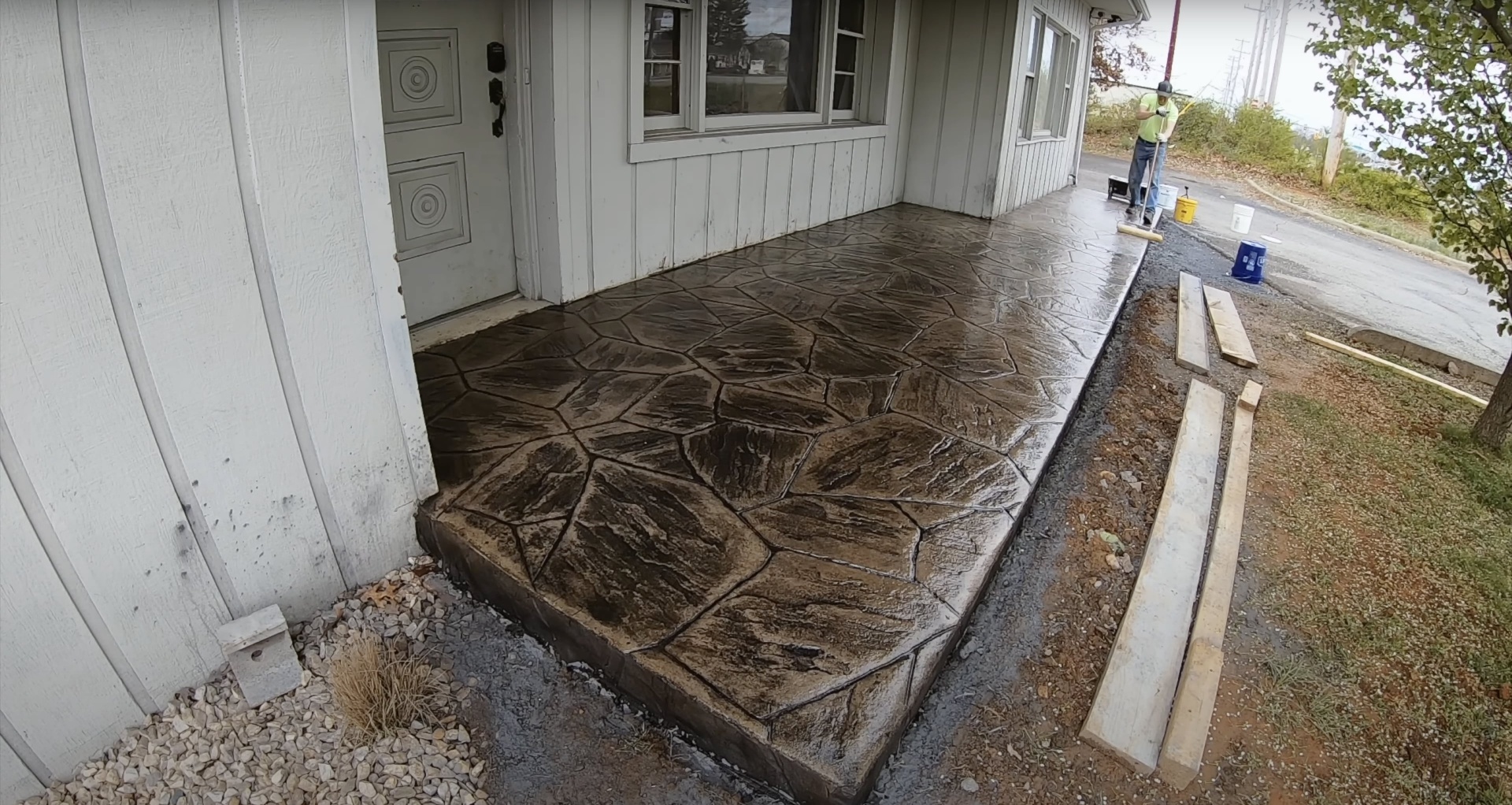 Stamped Concrete Patio Installation Beautiful stamped concrete patio with natural stone pattern showing professional craftsmanship